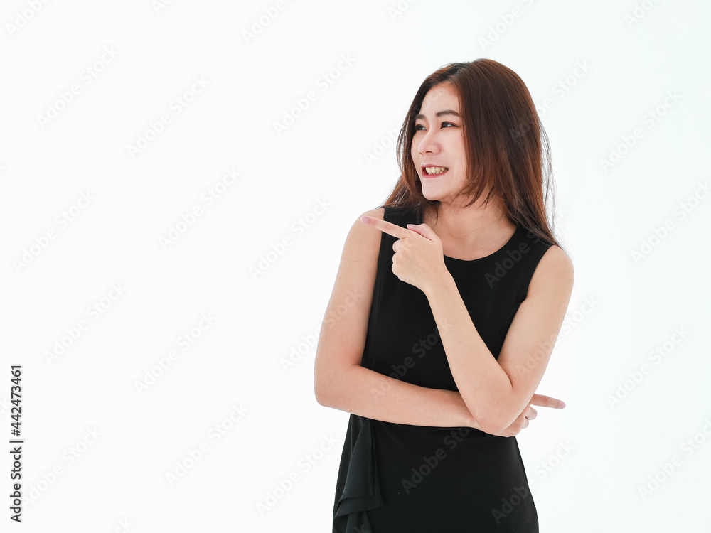 Young asian businesswoman with surprised expression point her finger aside to show something amazing. Standing on white background. Advertisement concept. Young asian businesswoman with surprised expression point her finger aside to show something amazing. Standing on white background. Advertisement concept.
