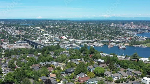 Drone flying over upper Queen Anne in Seattle with views of Lake Union,  Gas Works Park, University of Washington and Fremont on a clear sunny day. photo