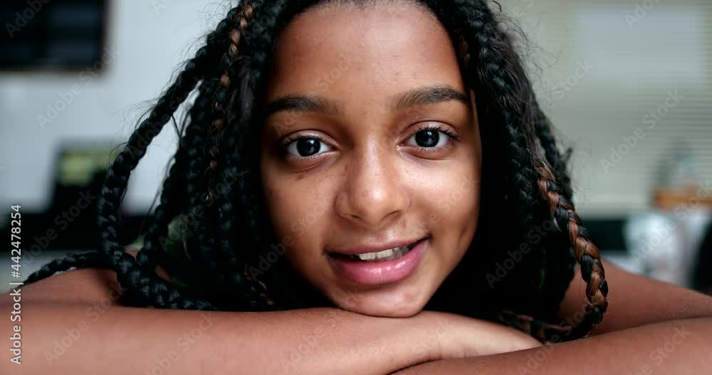 Child smiling portrait face close-up, diverse black hispanic girl Child smiling portrait face close-up, diverse black hispanic girl