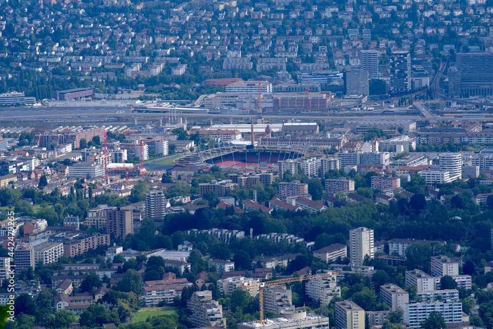 Panoramic view over City of Zurich seen from local mountain Uetliberg on a summer day. Photo taken June 29th, 2021, Zurich, Switzerland.