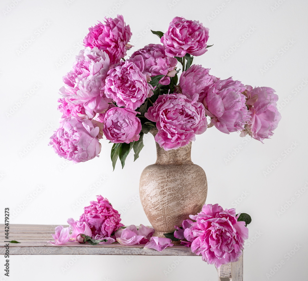 Beautiful bouquet of pink peonies in vase