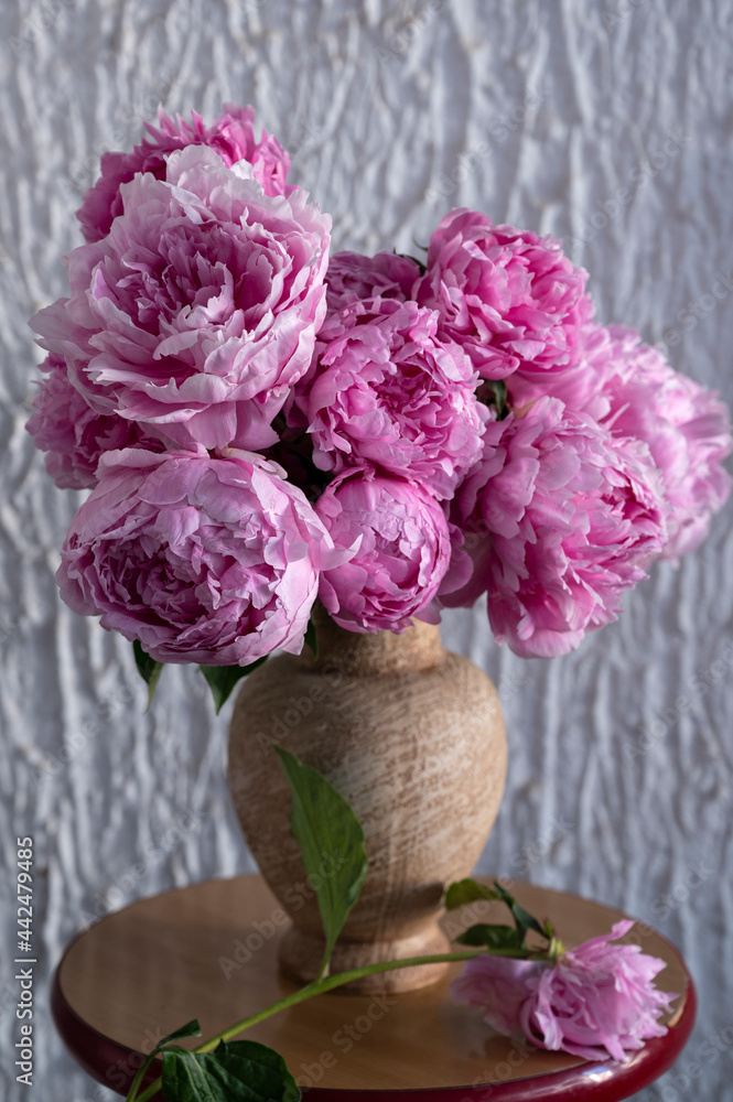 Beautiful bouquet of pink peonies in vase