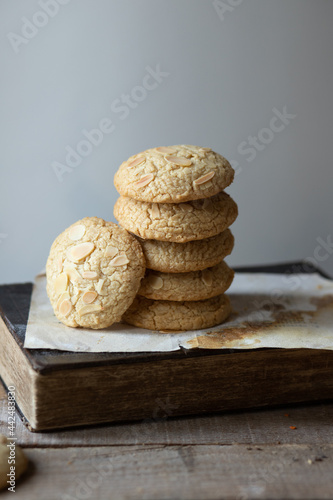 Tahini cookies on wooden table with old book 