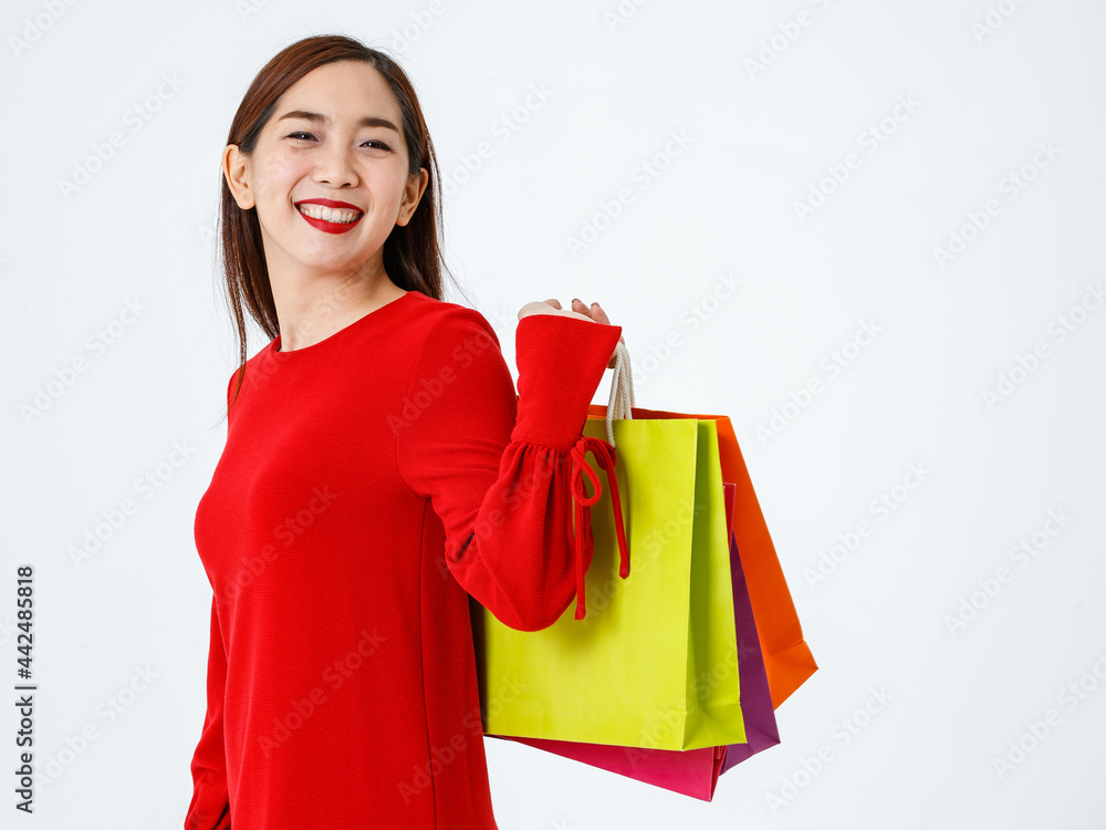 Positive ethnic woman with shopping bags in studio Positive ethnic woman with shopping bags in studio