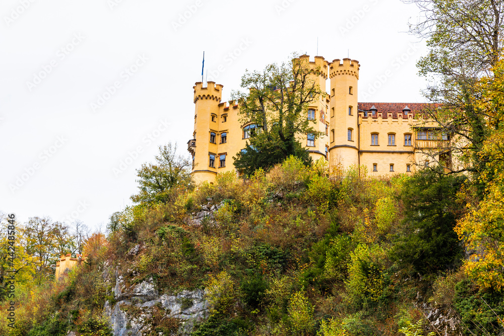 Landscape  of Hohenschwangau Castle, Bavaria, Germany. Beautiful panorama of mountain lakes. Scenery of  Alpine nature in autumn. Aerial scenic view of village in Alps.