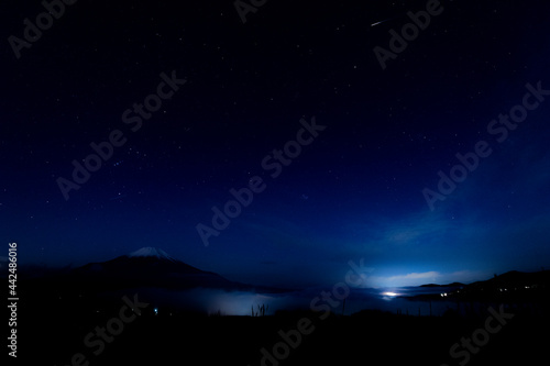 starry night sky with mountain