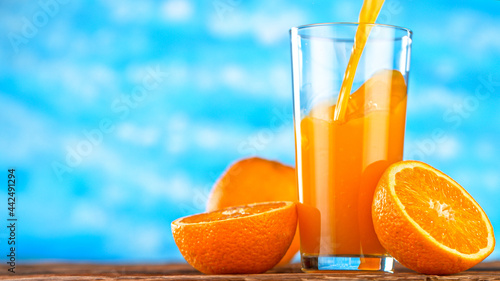 Fresh Orange Juice Being Po...