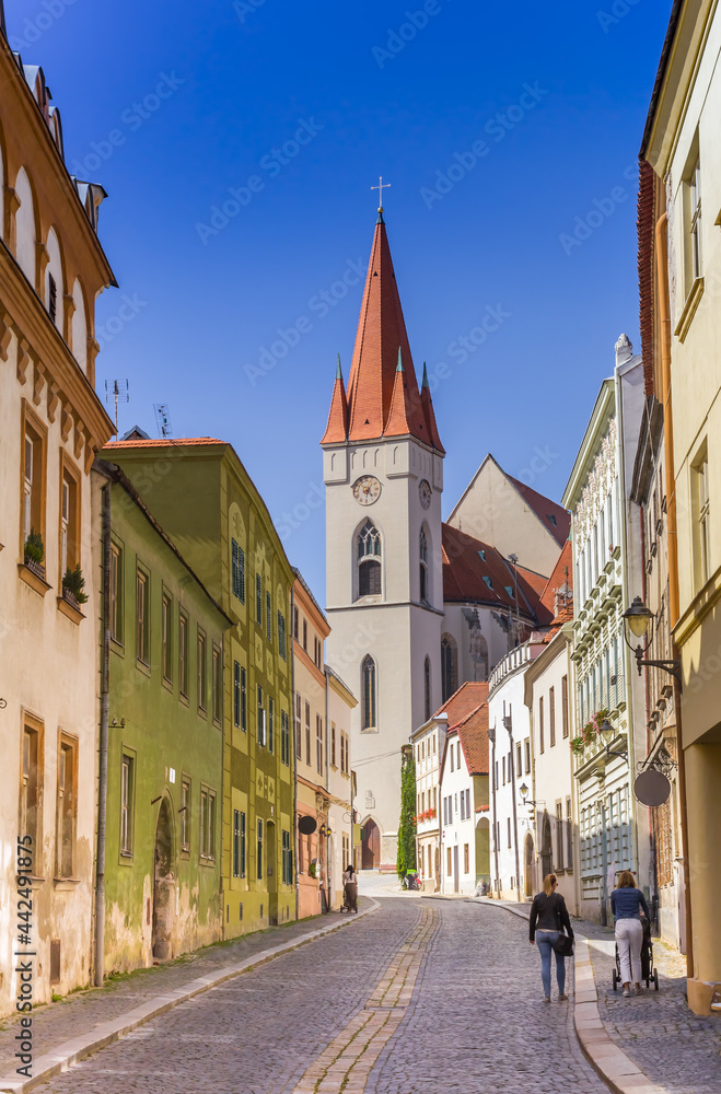 Colorful cobblestoned street leading to the Nicholas Church in Znojmo, Czech Republic