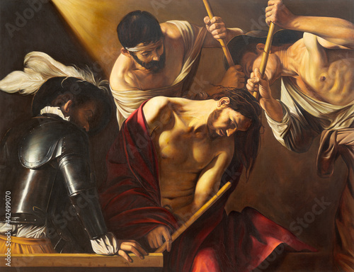 VIENNA, AUSTIRA - JUNI 18, 2021: The painting of The Crowning with Thorns in church Rochuskirche  as the copy of Caravaggio by unknown artist. photo