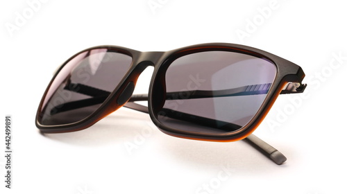 Modern stylish black sunglasses with polarized lenses isolated on white background