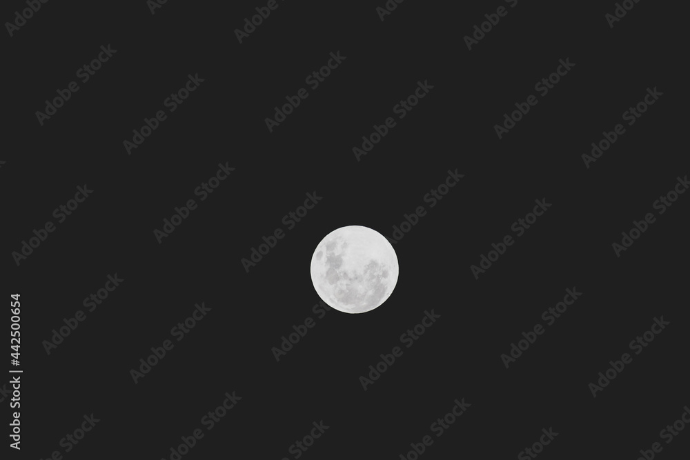 full moon in the night sky shot with telephoto lens. full moon in the night sky shot with telephoto lens.