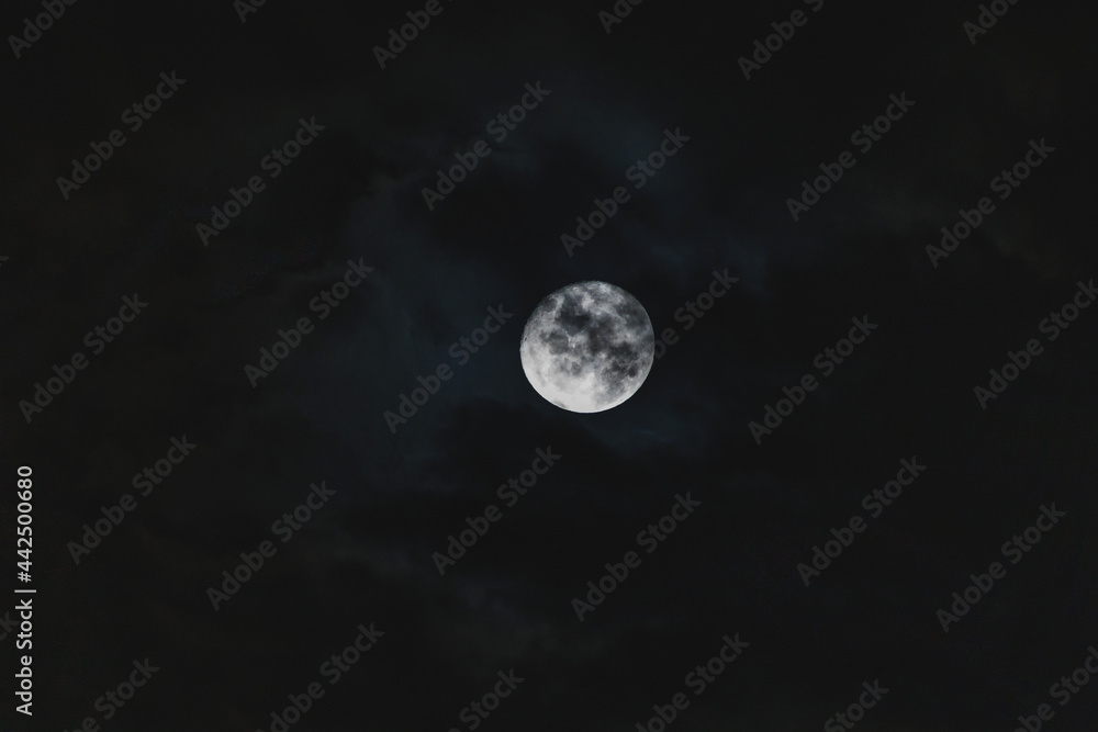 full moon in the night sky shot with telephoto lens. full moon in the night sky shot with telephoto lens.
