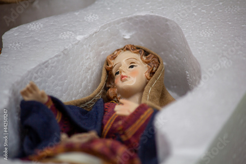 maria figurine in plastic box