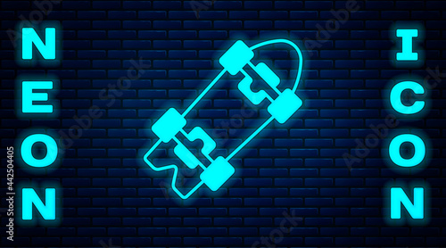 Glowing neon Longboard or skateboard cruiser icon isolated on brick wall background. Extreme sport. Sport equipment. Vector