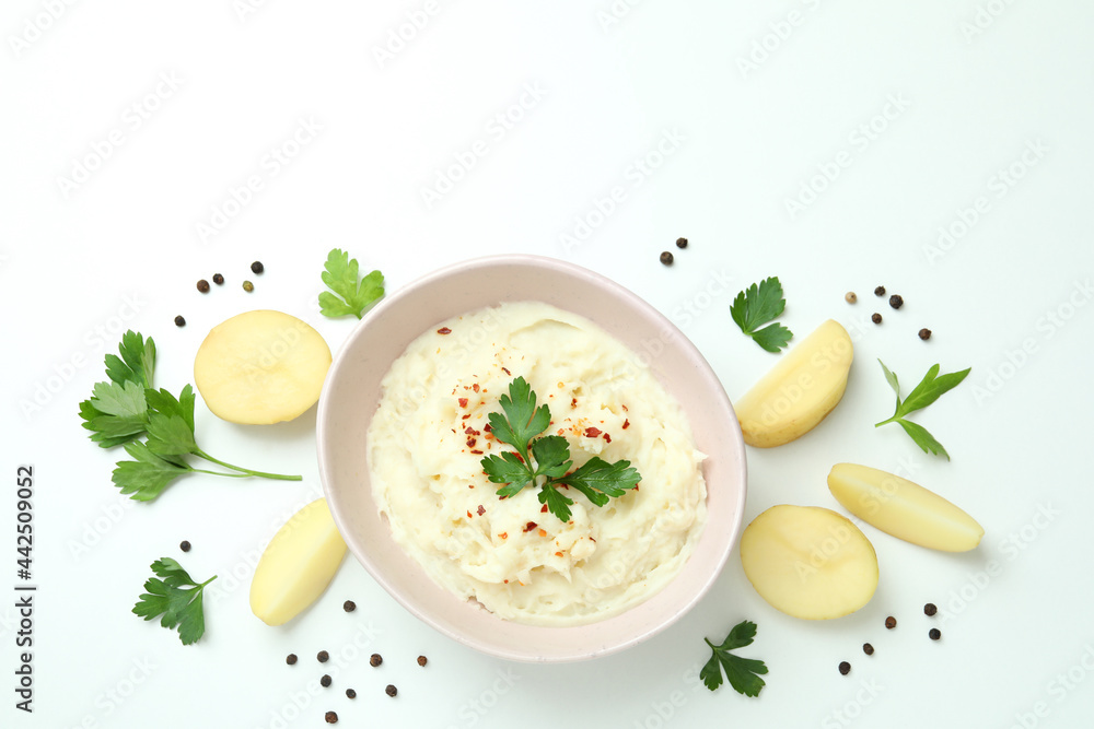 Plate of mashed potatoes and ingredients on white background Plate of mashed potatoes and ingredients on white background
