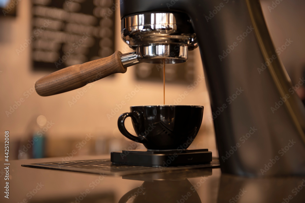 Close up view of preparing coffee cappuccino in automatic coffee machine in cafe Close up view of preparing coffee cappuccino in automatic coffee machine in cafe