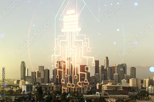 Virtual creative idea concept with light bulb and microcircuit illustration on Los Angeles skyline background. Neural networks and machine learning concept. Multiexposure