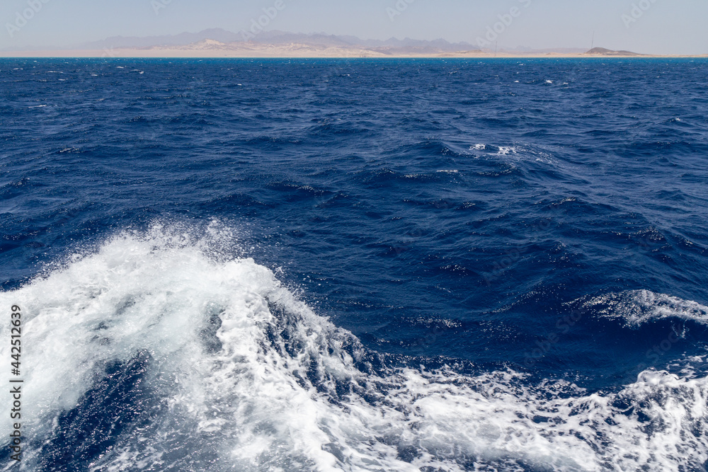 View from the stern of the yacht while sailing. View from the stern of the yacht while sailing.
