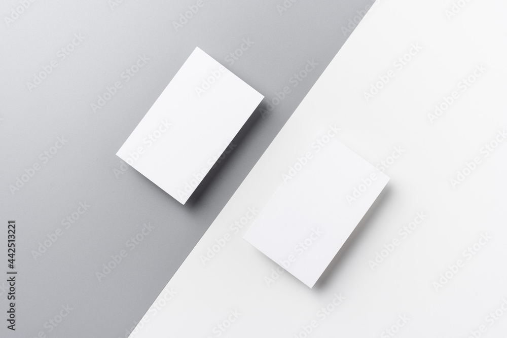 Top view of business card isolated on white & grey Top view of business card isolated on white & grey