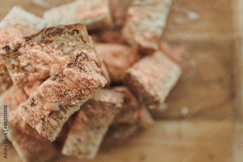 Close up of crispy stick breads with cheese powder. Close up of crispy stick breads with cheese powder.