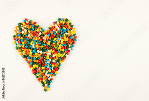 Colorful heart shape of different multicolored sprinkles