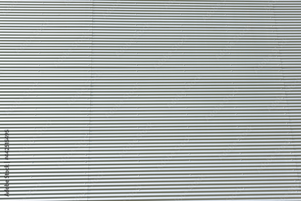 Surface of corrugated metallic texture.Industrial wall.