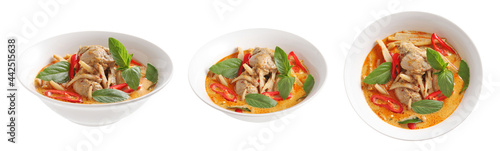 Thai chicken and bamboo shoot curry in ceramic bowl on white background
