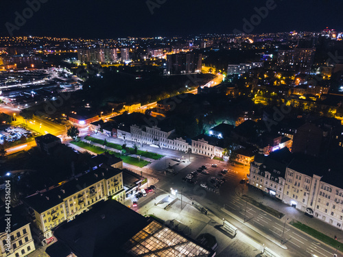 City center aerial view on Bursatskyi descent and Klochkivska St from Konstytutsii Square in Kharkiv, Ukraine. Night lights illuminated cityscape photo