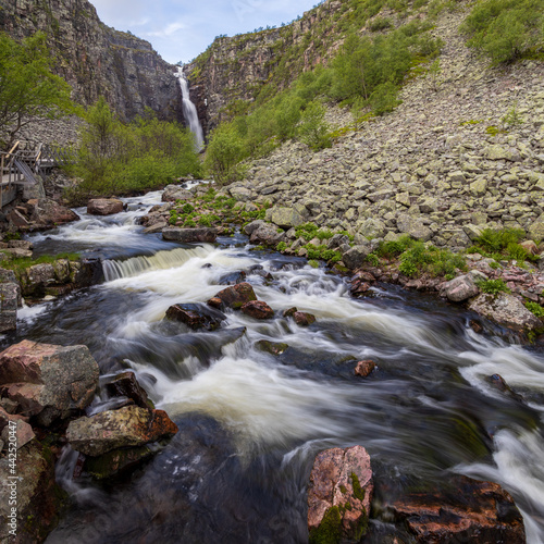 Long exposure of Swedens highest waterfall "Njupeskär" and the stream  in Fulufjället national park during a summer morning. 