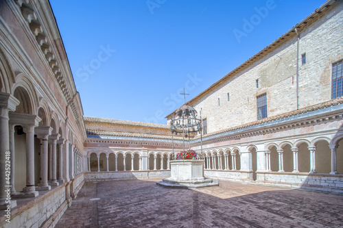 The Abbey of Sassovivo is a Benedictine monastery in Umbria, founded by the Benedictines around 1070, The Romanesque cloister 1229, ordered by the abbot Angelo and completed by the Roman marble master photo