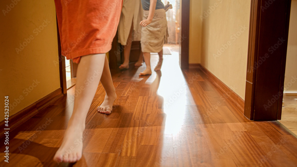 Big family with children walking out of their bedrooms wearing bathrobes at morning. Concept of family living in big house or on vacation Big family with children walking out of their bedrooms wearing bathrobes at morning. Concept of family living in big house or on vacation