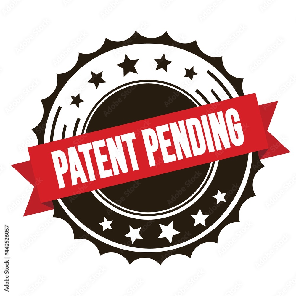 PATENT PENDING text on red brown ribbon stamp. PATENT PENDING text on red brown ribbon stamp.