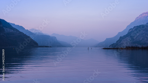 Silhouettes of the Alps mountains at sunset. Lake Uri. Switzerland.