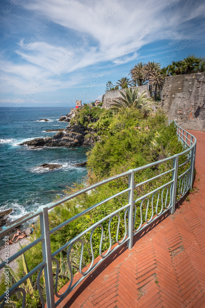 View of the beautiful promenade of Nervi in Genoa, with palm trees and bricks, Italy.