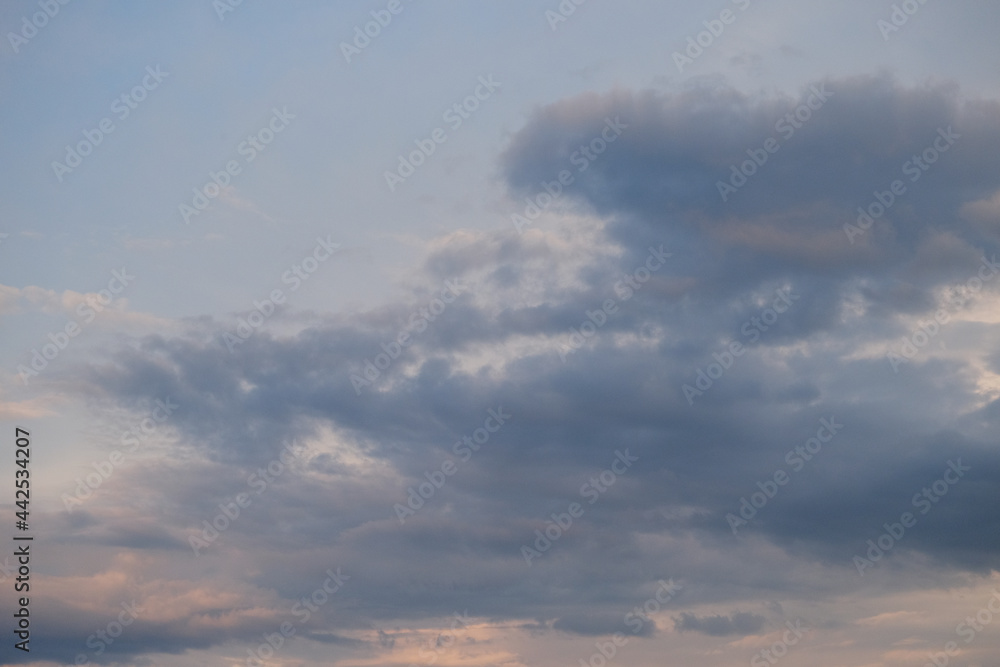 Fototapeta premium Cumulus clouds in the sky at sunset. Dramatic sky.