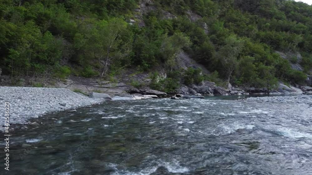 view from the drone of the river rapids with little water due to the decrease of glaciers in the high mountains - scarcity of water and drought in Italy , Val Trebbia, Bobbio view from the drone of the river rapids with little water due to the decrease of glaciers in the high mountains - scarcity of water and drought in Italy , Val Trebbia, Bobbio