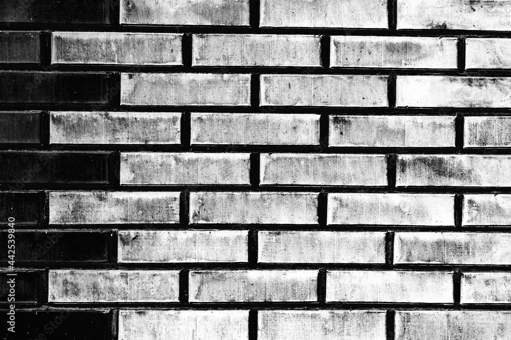 Texture of a brick wall with cracks and scratches which can be used as a background Texture of a brick wall with cracks and scratches which can be used as a background