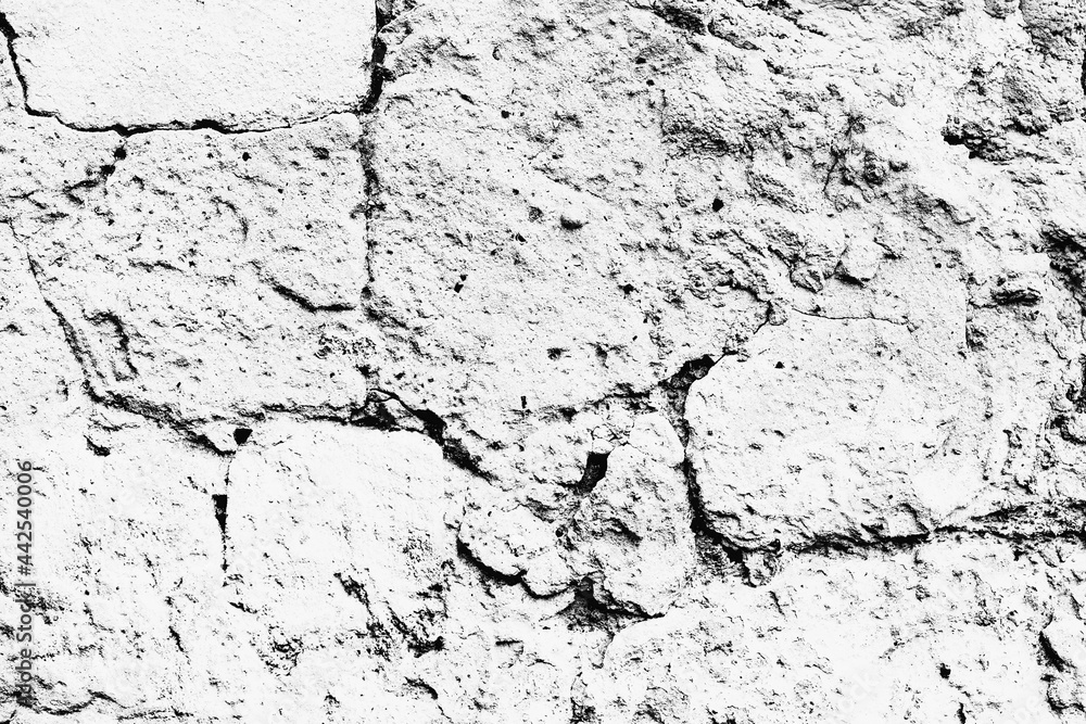 Fototapeta premium Texture of a brick wall with cracks and scratches which can be used as a background