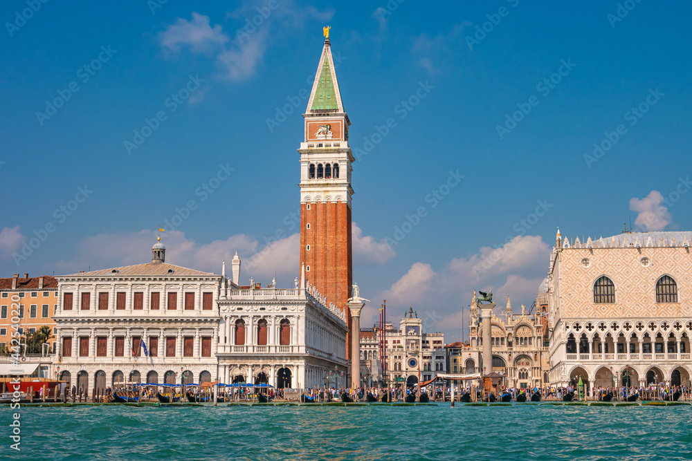 Full size view of Campanile Bell Tower at San Marco square in Venice, Italy, at sunny day and deep blue sky.