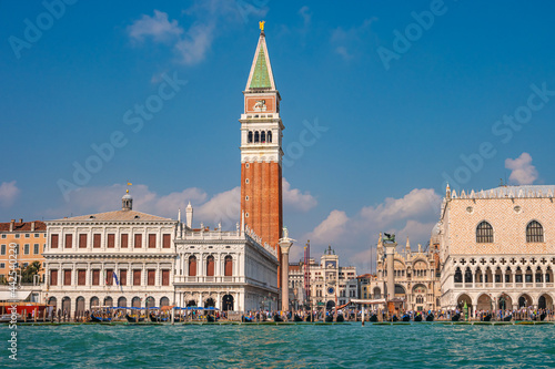 Full size view of Campanile Bell Tower at San Marco square in Venice, Italy, at sunny day and deep blue sky. © neurobite