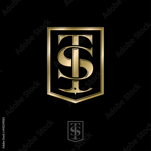 Gold T and S letters in shield. T, S monogram with alpenstock. Alpinism icon. Emblem for sportswear, mountaineering. Mountain tourism emblem. Climbing club emblem.  photo