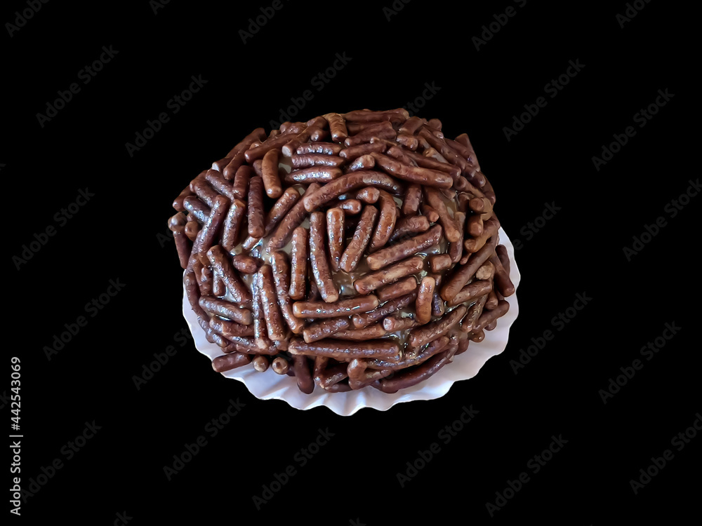 Brazilian chocolate ball known as Brigadeiro. close-up shot isolated on black
