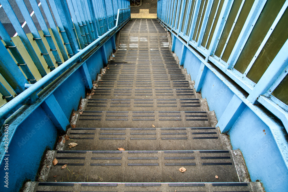 Fototapeta premium The blue stairs of pedestrian bridge.