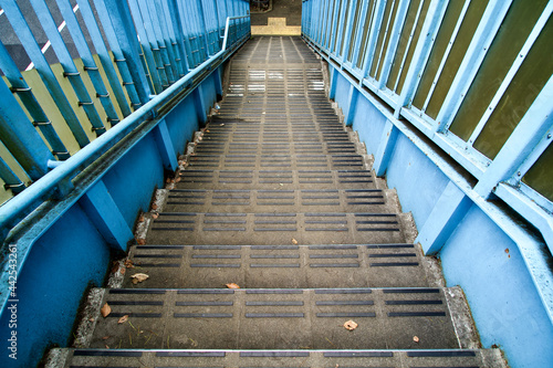 The blue stairs of pedestrian bridge.
