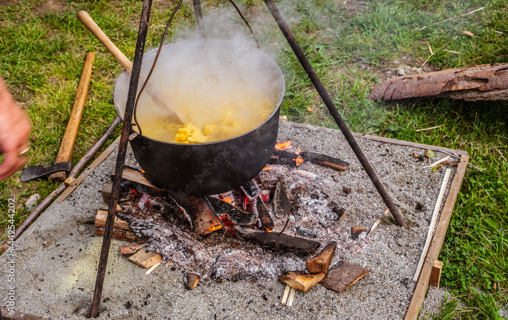 Romanian traditional food prepared at the cauldron on the open fire Romanian traditional food prepared at the cauldron on the open fire
