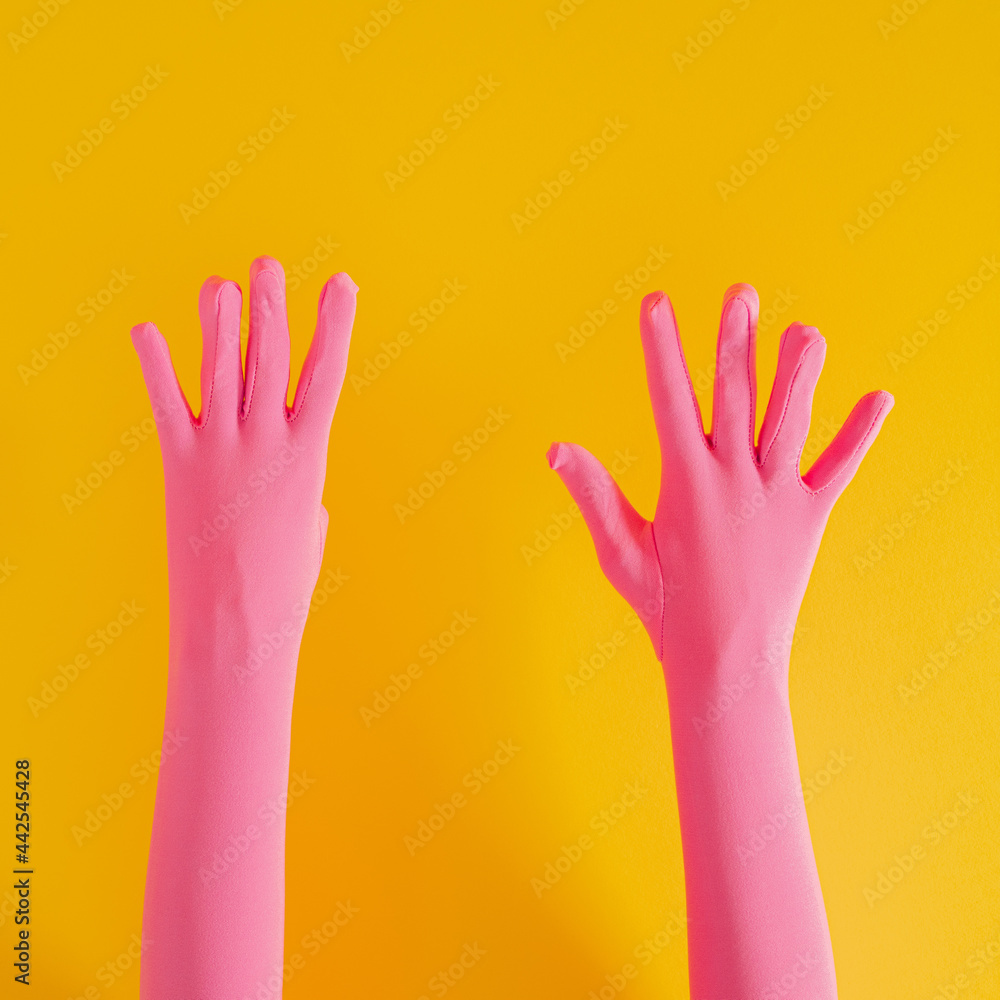 hands with pink glove and number nine on yellow sunny summer background. modern summer abstract art hands with pink glove and number nine on yellow sunny summer background. modern summer abstract art