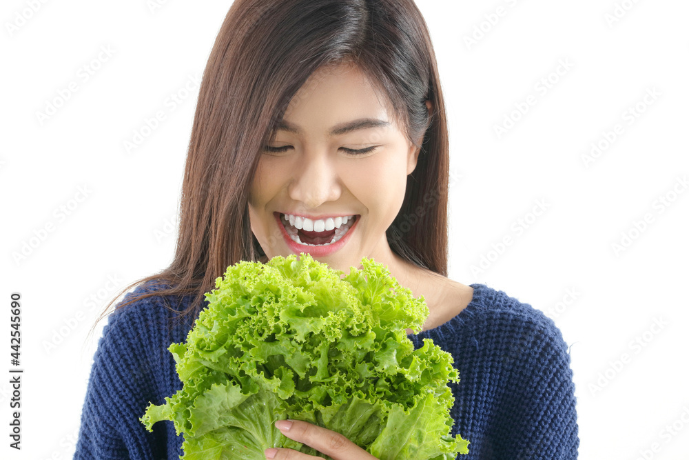 beautiful asian girl Have a bright and healthy smile holding organic vegetables. Healthy eating concept. white background beautiful asian girl Have a bright and healthy smile holding organic vegetables. Healthy eating concept. white background