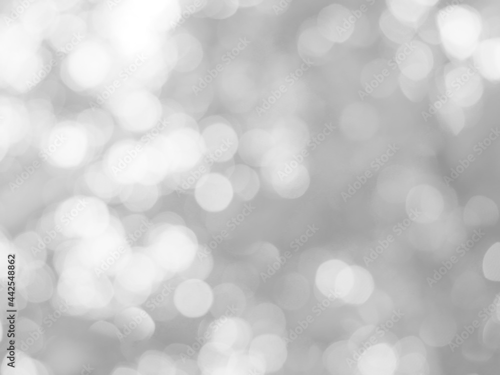 The glowing white bokeh image can be used as a background illustration or to add text to an advertisement.