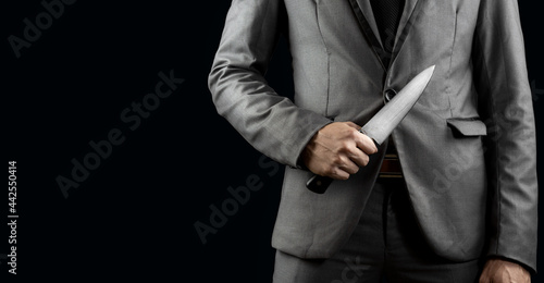 businessman holding knife for blackmail concept. Fototapeta