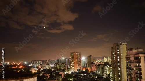 Wallpaper Mural 4k dramatic Mumbai city night skyline timelapse with clouds moving passing over city & moon waxing behind at twilight Torontodigital.ca